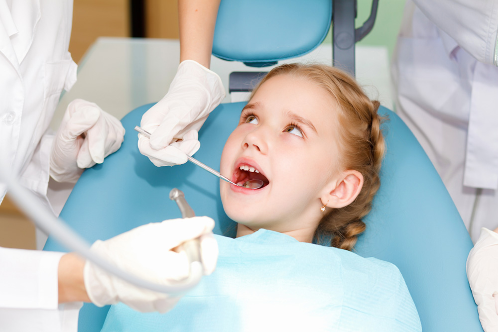 Little girl at the pediatric dentist