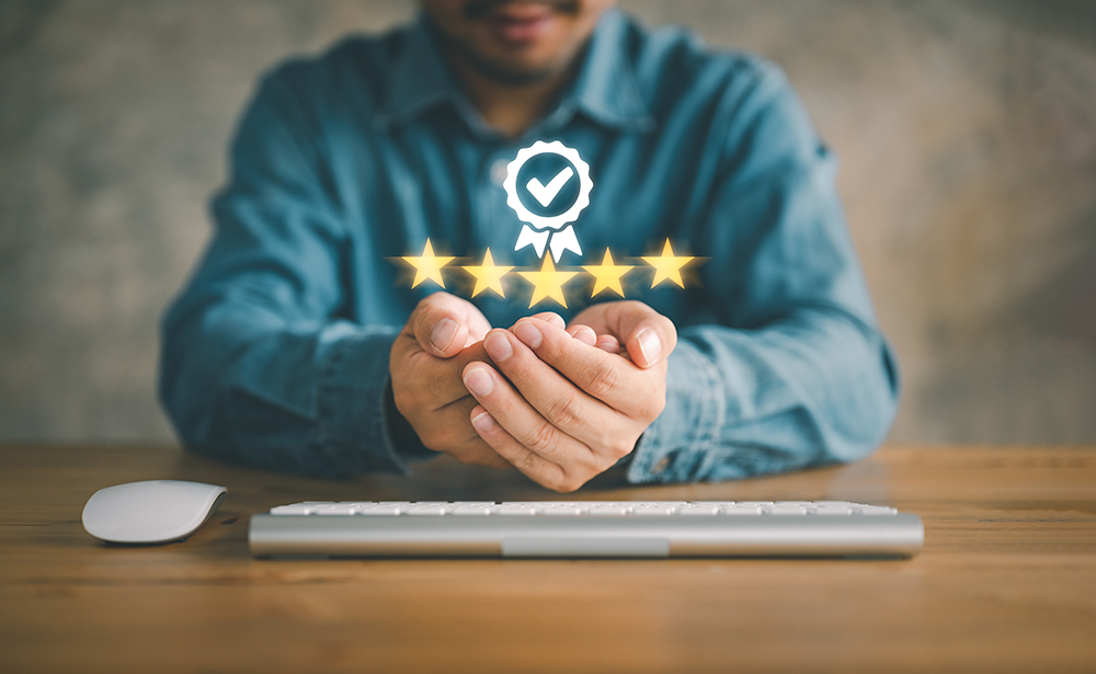 Image showing a man holding 5 star reviews above his hand